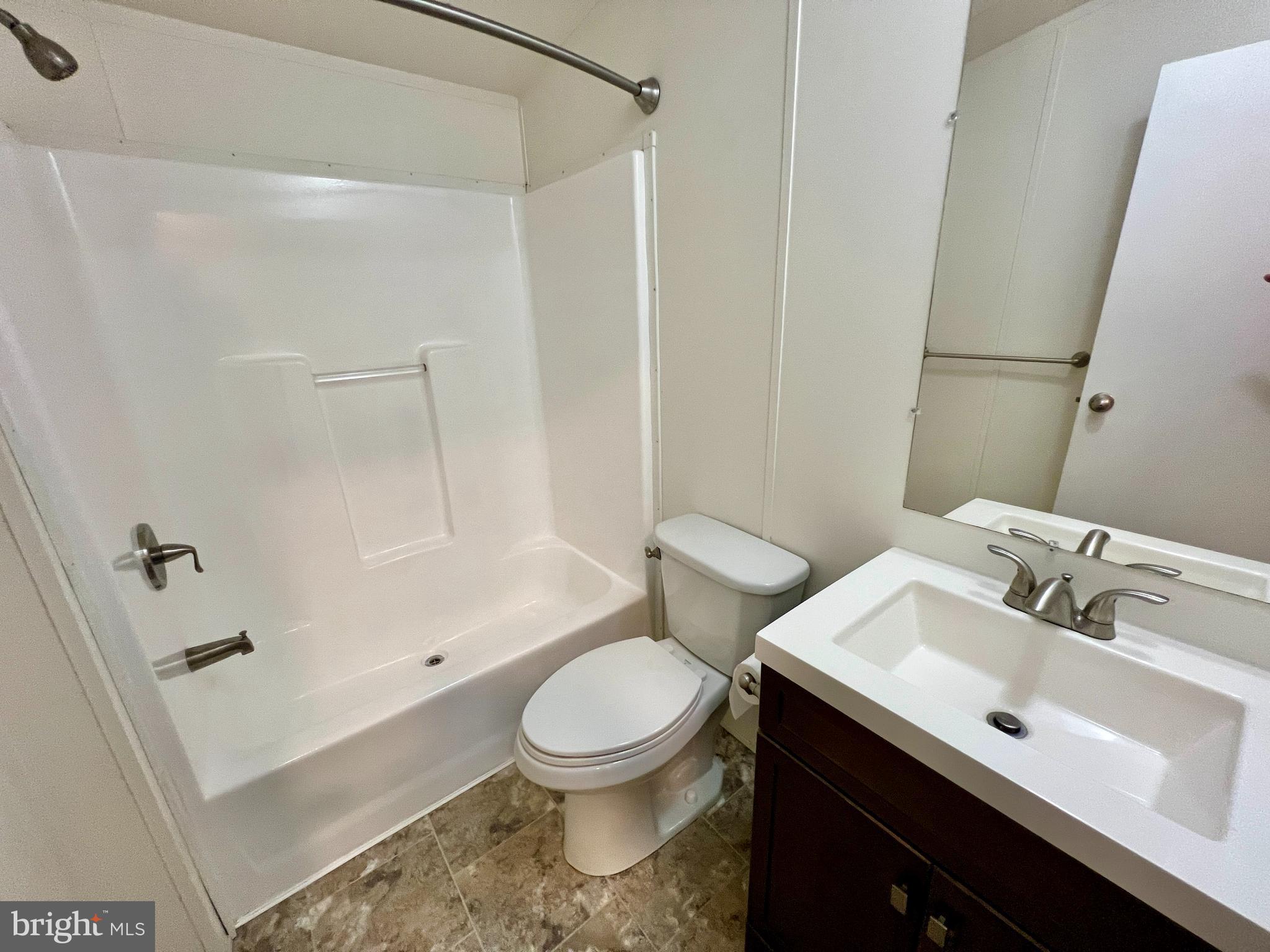 22609 Camp Arrowhead Road Lewes, DE 19958 - Photo 25 of 48 a bathroom with a sink toilet and shower