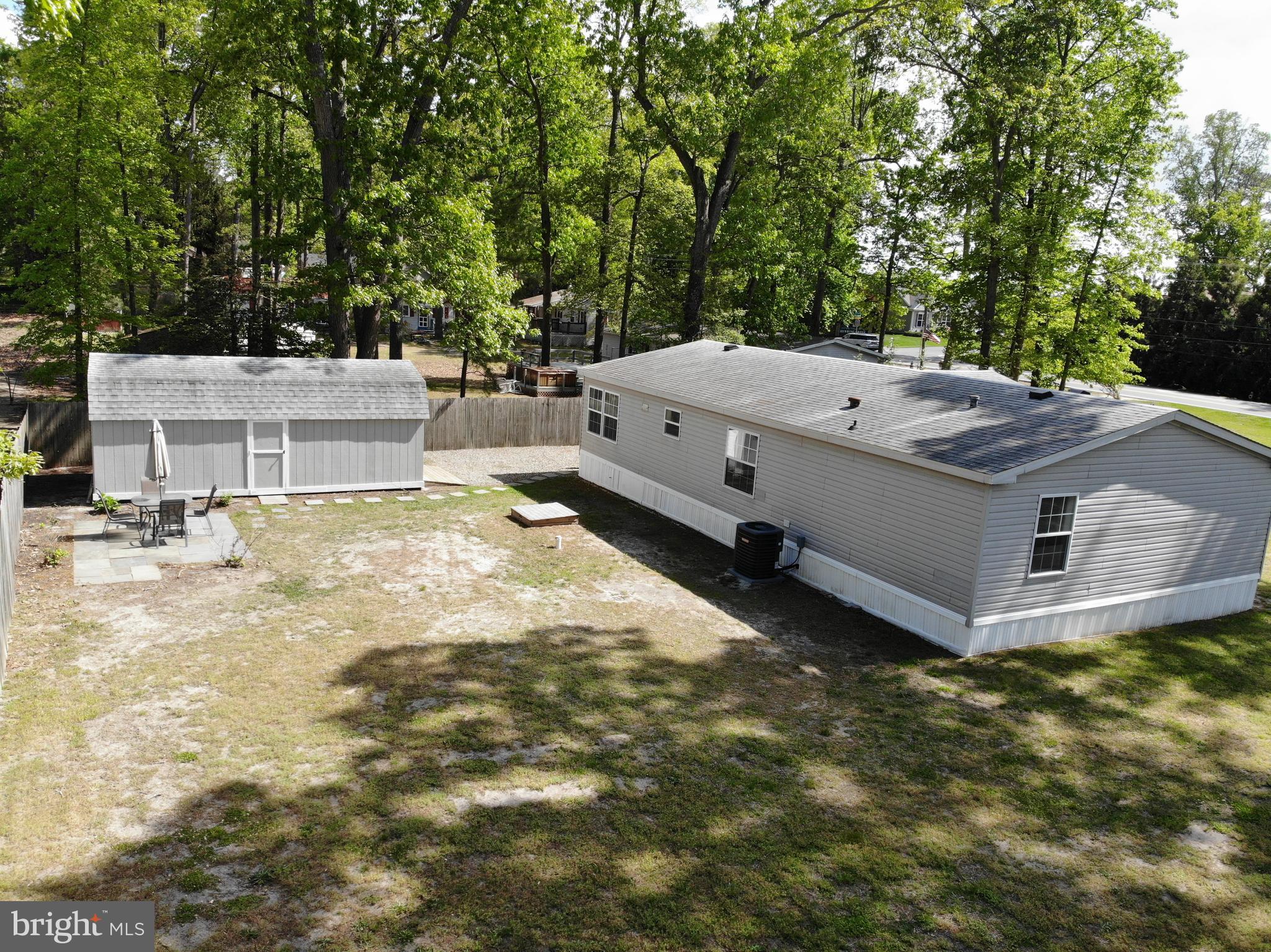 22609 Camp Arrowhead Road Lewes, DE 19958 - Photo 46 of 48 a view of a house with a yard and sitting area