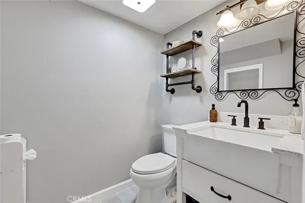 a bathroom with a sink toilet and vanity