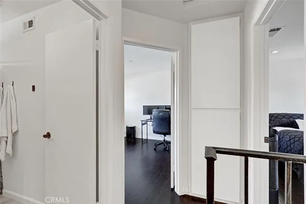 a view of a livingroom with workspace and a window