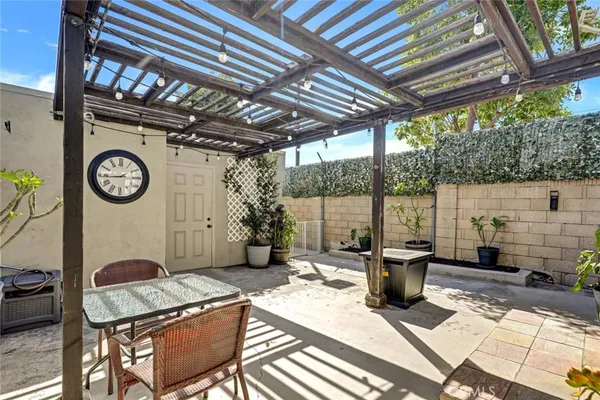 a view of a chairs and table in the patio