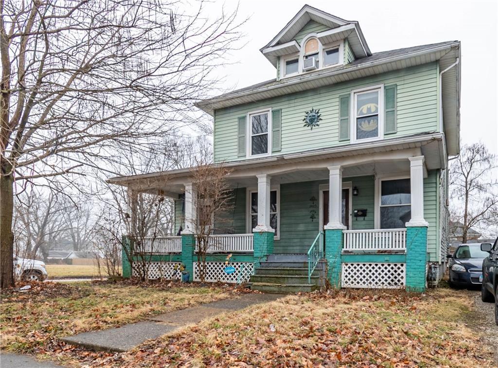1405 West Wood Street Decatur, IL 62522 - Photo 1 of 1 a front view of a house with a garden