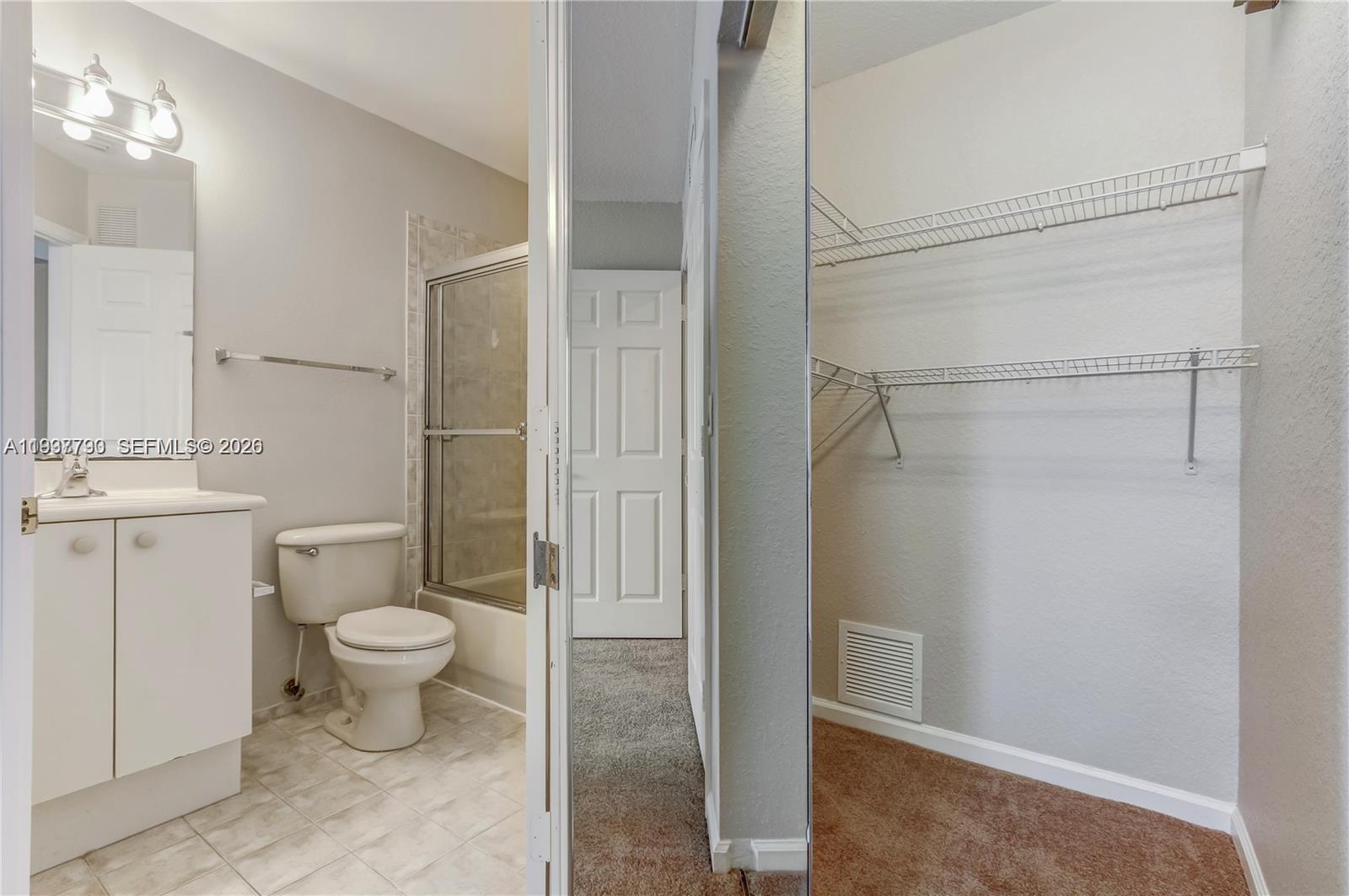 2830 Southwest 83rd Terrace, Unit 101 Miramar, FL 33025 - Photo 11 of 15 a bathroom with a sink toilet and shower