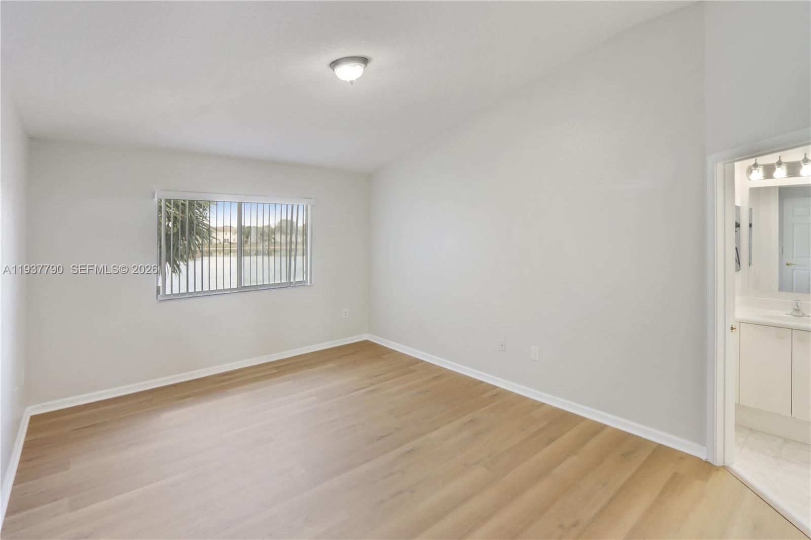 2830 Southwest 83rd Terrace, Unit 101 Miramar, FL 33025 - Photo 13 of 21 an empty room with windows