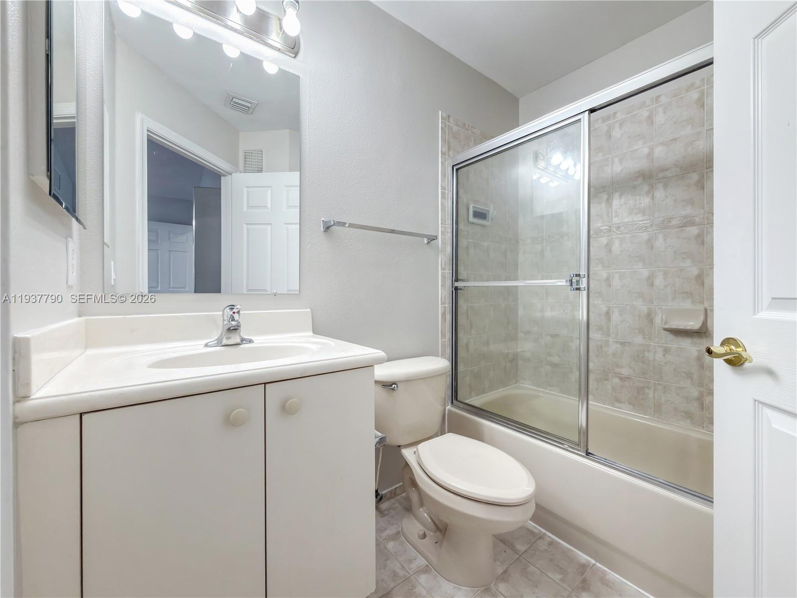 2830 Southwest 83rd Terrace, Unit 101 Miramar, FL 33025 - Photo 15 of 21 a bathroom with a sink toilet and shower