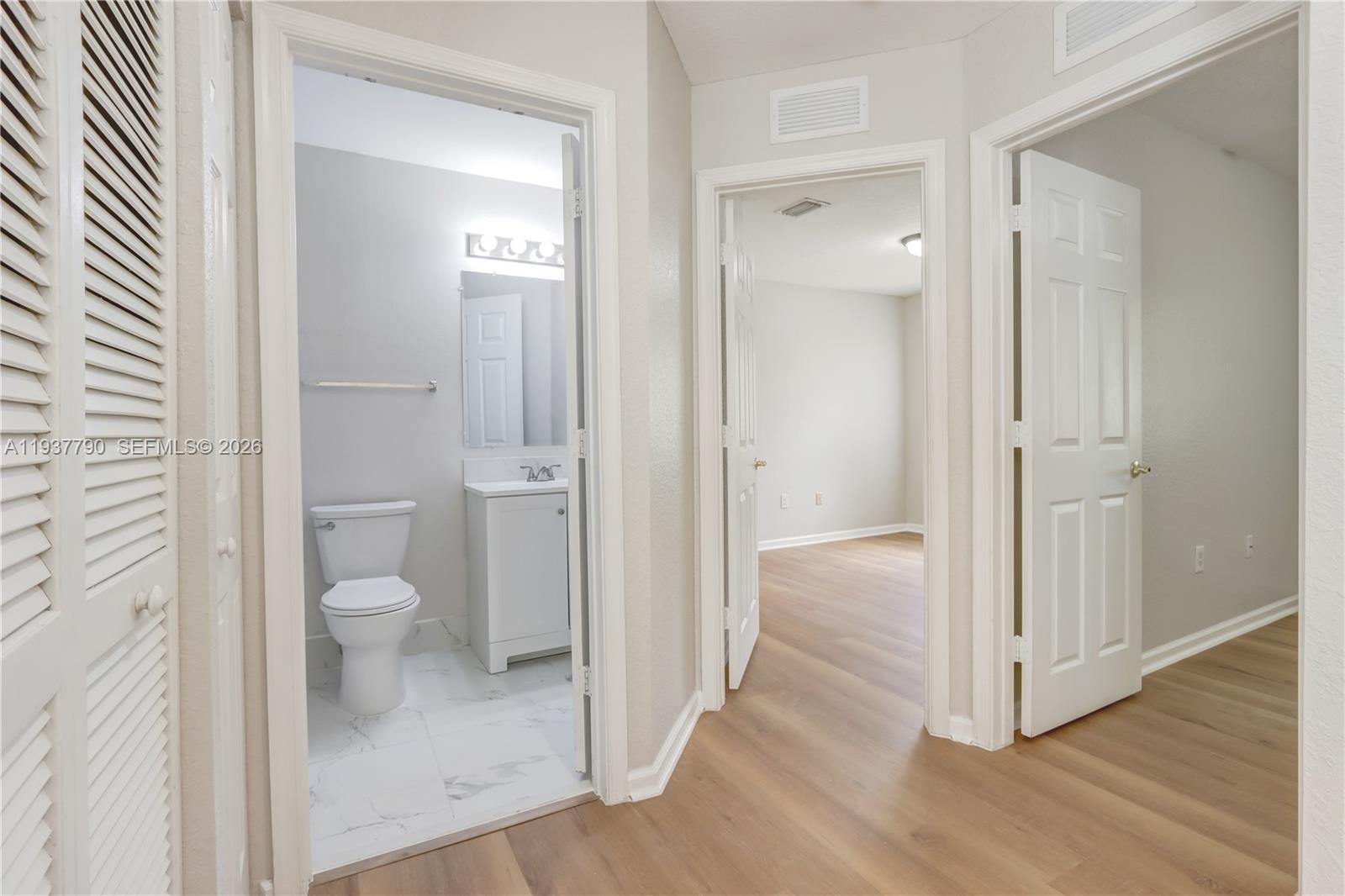2830 Southwest 83rd Terrace, Unit 101 Miramar, FL 33025 - Photo 16 of 21 a bathroom view of a toilet and a shower