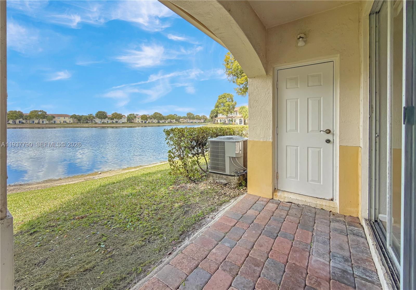 2830 Southwest 83rd Terrace, Unit 101 Miramar, FL 33025 - Photo 3 of 21 a view of a lake with a big yard