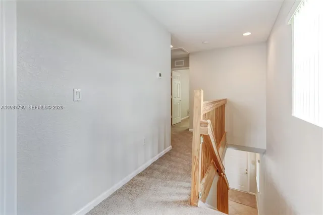 a view of hallway with stairs