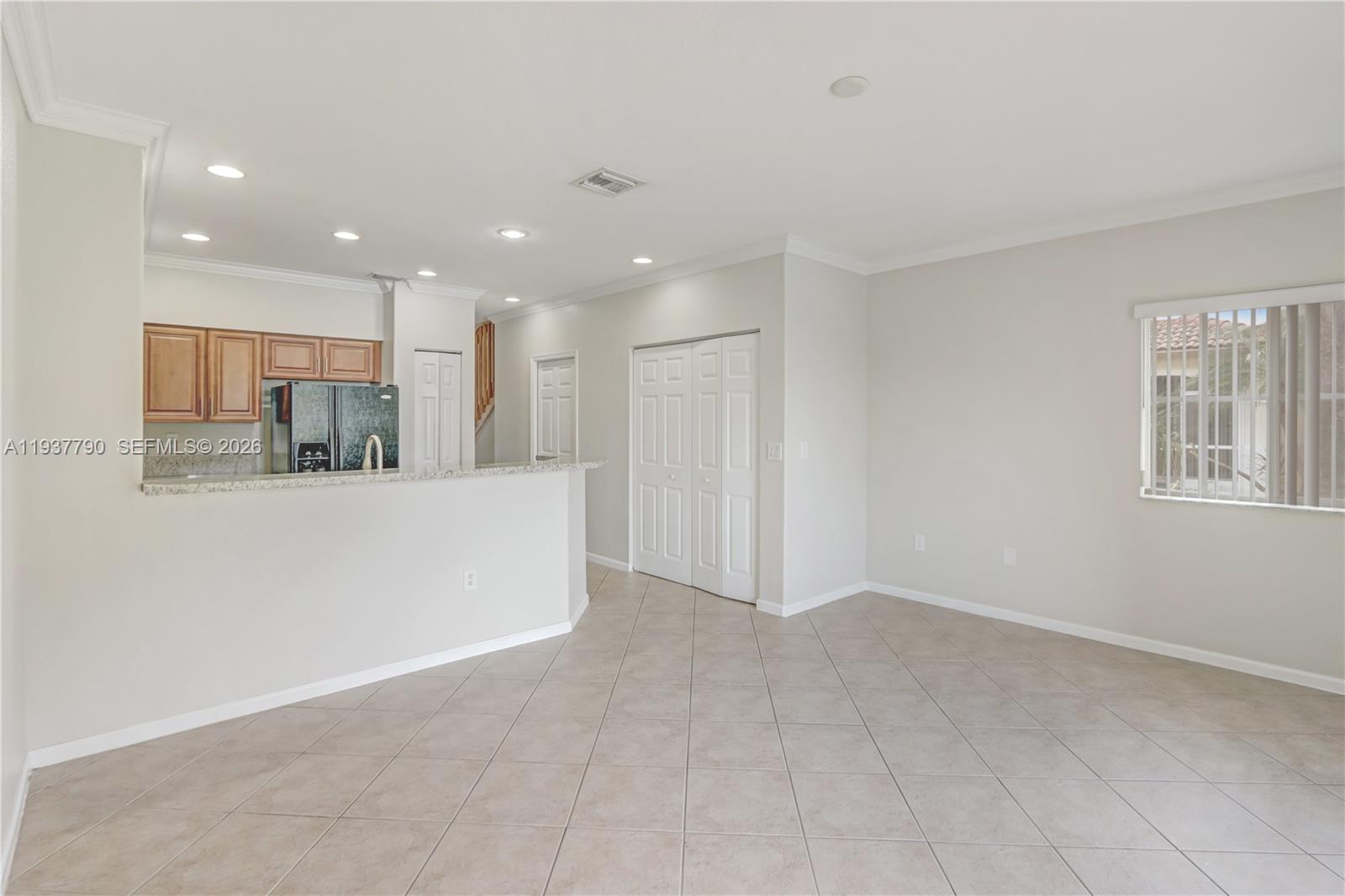 2830 Southwest 83rd Terrace, Unit 101 Miramar, FL 33025 - Photo 9 of 21 a view of kitchen with kitchen island and stainless steel appliances