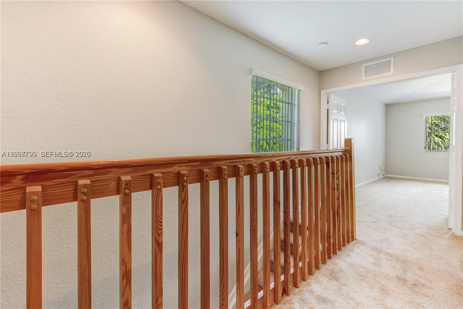 2830 Southwest 83rd Terrace, Unit 101 Miramar, FL 33025 - Photo 9 of 15 a view of a porch with wooden floor