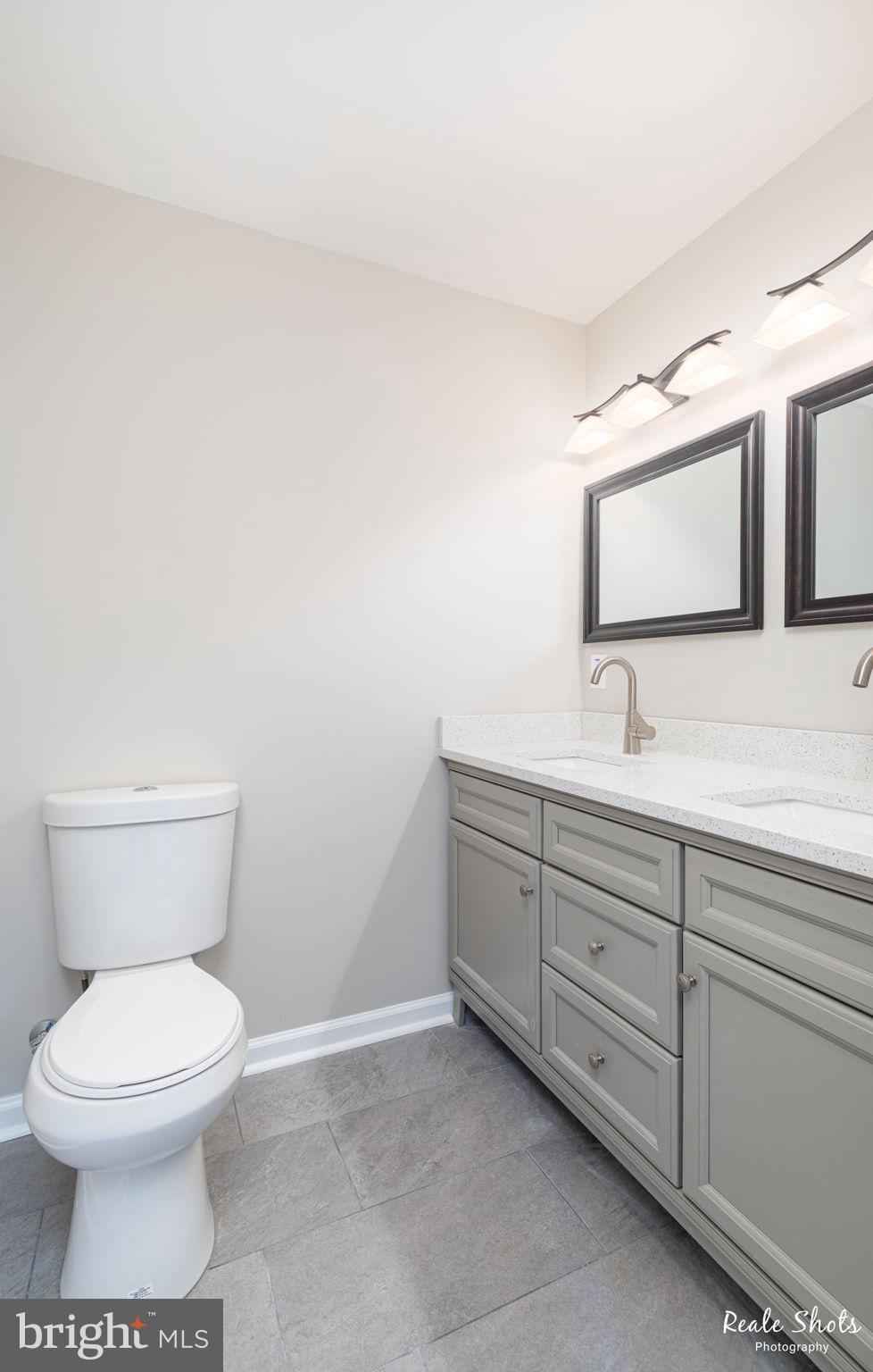 2006 Birch Road Baltimore, MD 21221 - Photo 16 of 37 a bathroom with a toilet sink and mirror