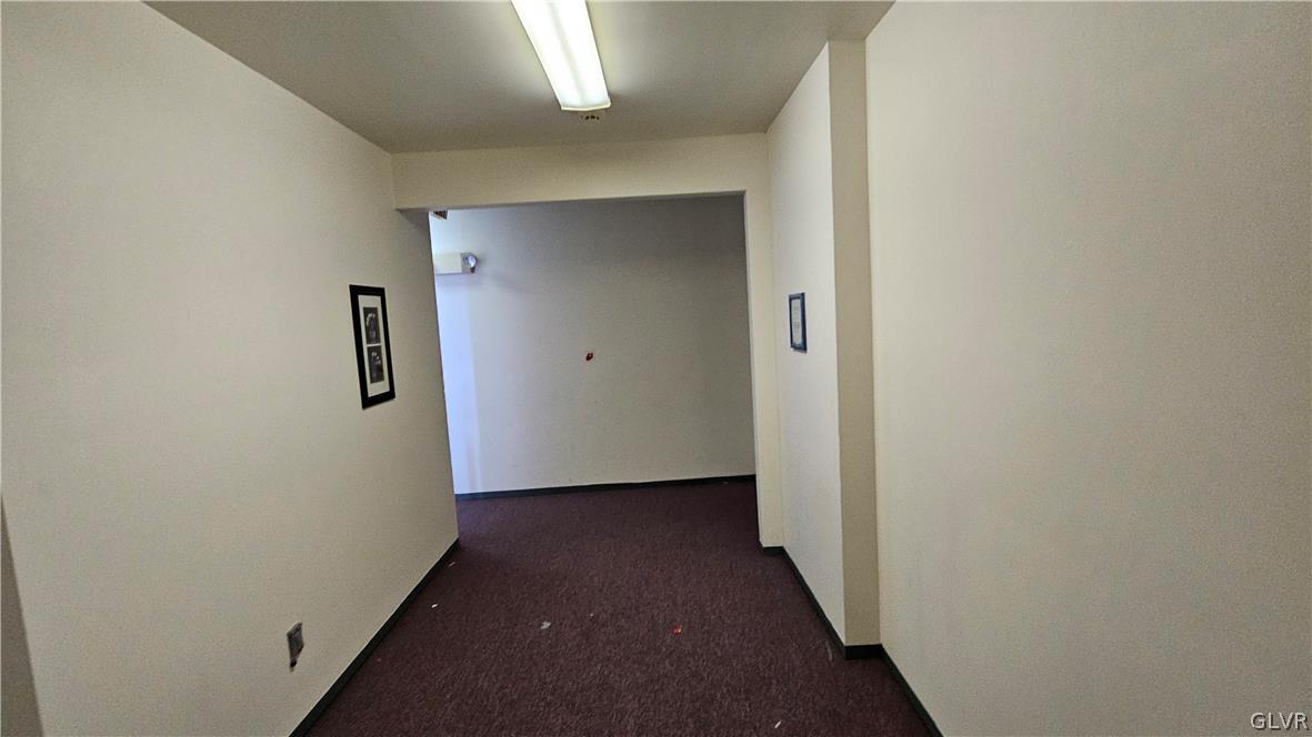 1306 East 4th Street Bethlehem, PA 18015 - Photo 11 of 47 a view of a hallway with wooden floor