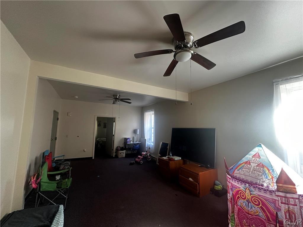 1306 East 4th Street Bethlehem, PA 18015 - Photo 20 of 47 a living room with furniture and a flat screen tv