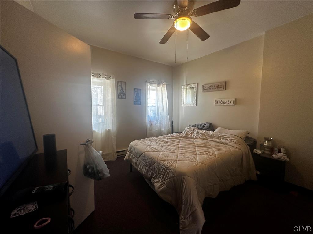 1306 East 4th Street Bethlehem, PA 18015 - Photo 26 of 47 a bedroom with a bed and a chandelier