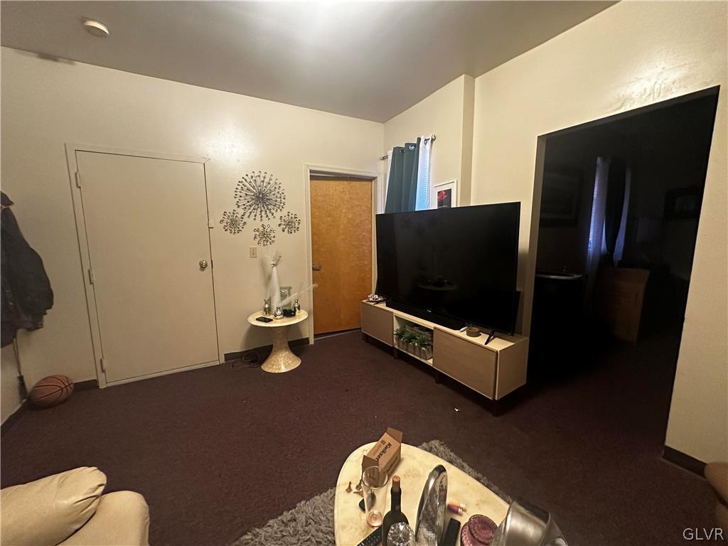 1306 East 4th Street Bethlehem, PA 18015 - Photo 29 of 47 a living room with a flat screen tv and gym equipment