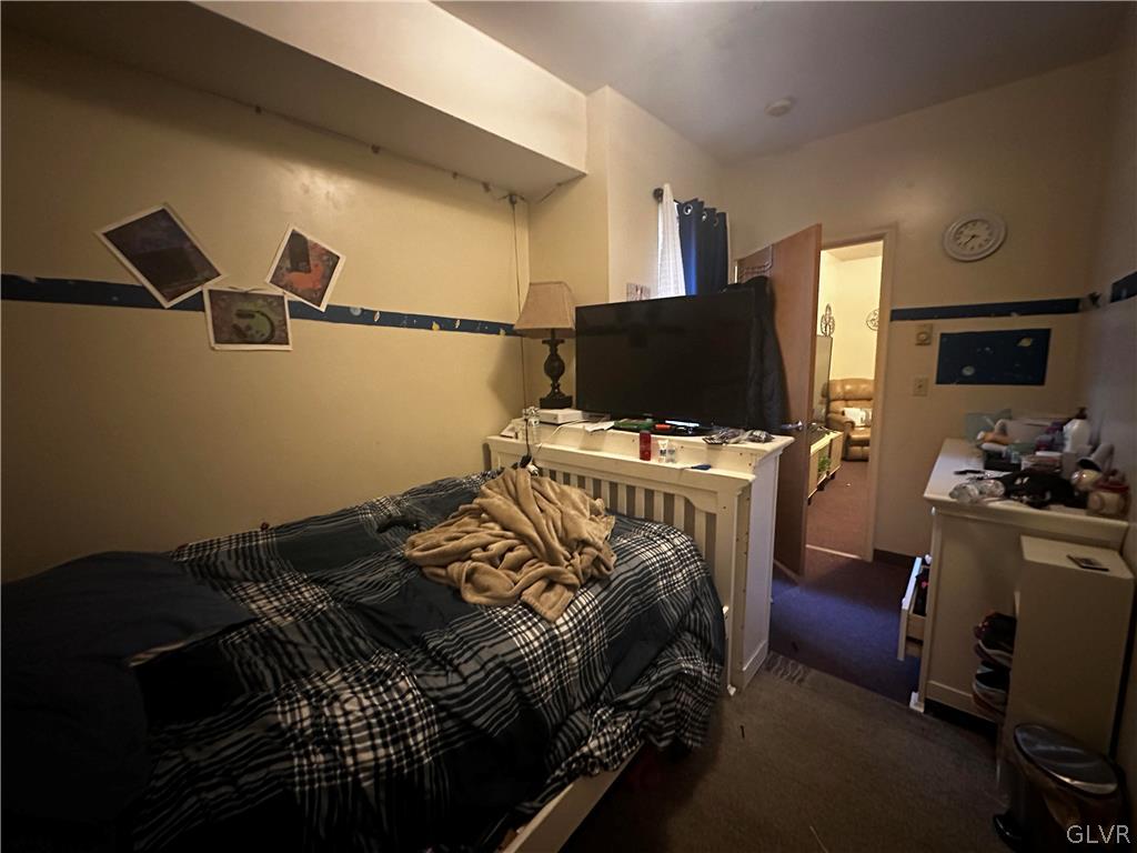 1306 East 4th Street Bethlehem, PA 18015 - Photo 30 of 47 a bedroom with a bed and flat screen tv
