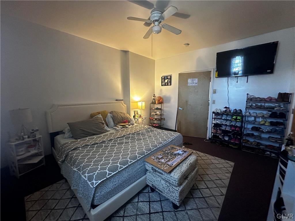 1306 East 4th Street Bethlehem, PA 18015 - Photo 37 of 47 a bedroom with a bed and a flat screen tv