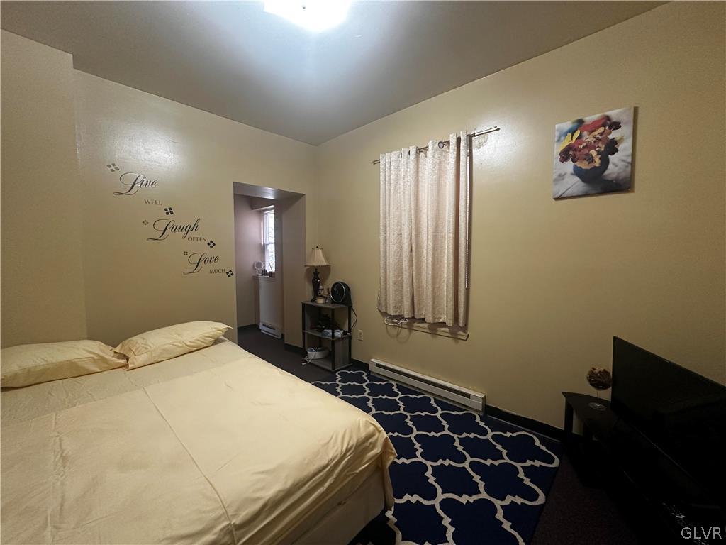 1306 East 4th Street Bethlehem, PA 18015 - Photo 40 of 47 a bedroom with a bed and a dresser