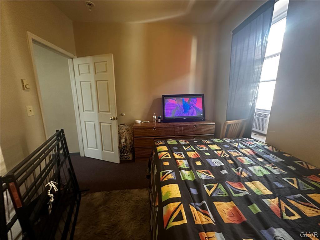 1306 East 4th Street Bethlehem, PA 18015 - Photo 47 of 47 a bedroom with a bed and flat screen tv