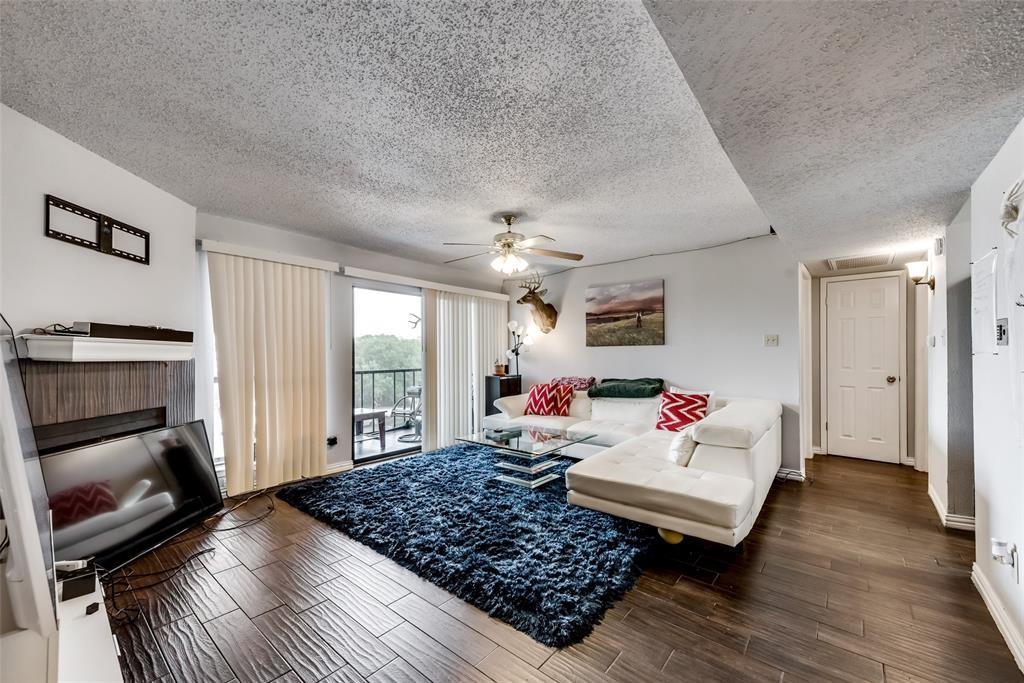 a living room with furniture rug and window