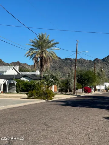 a view of a street with cars