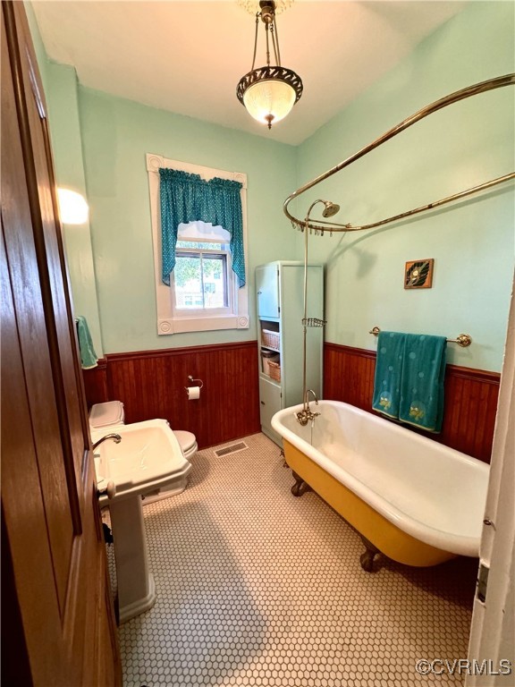 600 Virginia Street Ashland, VA 23005 - Photo 11 of 33 a bathroom with a sink a toilet a mirror and shower