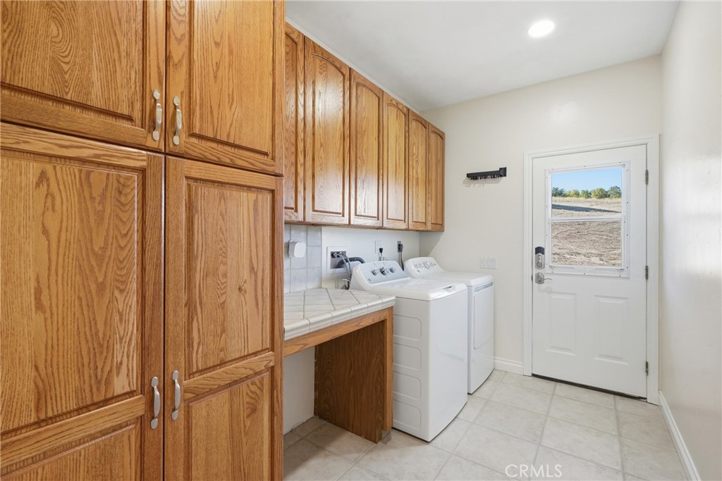 220 Cook Court Templeton, CA 93465 - Photo 29 of 45 a view of a storage and utility room with closet dryer