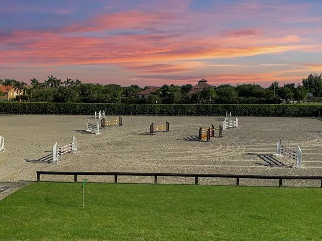 a view of swimming pool with seating area and yard