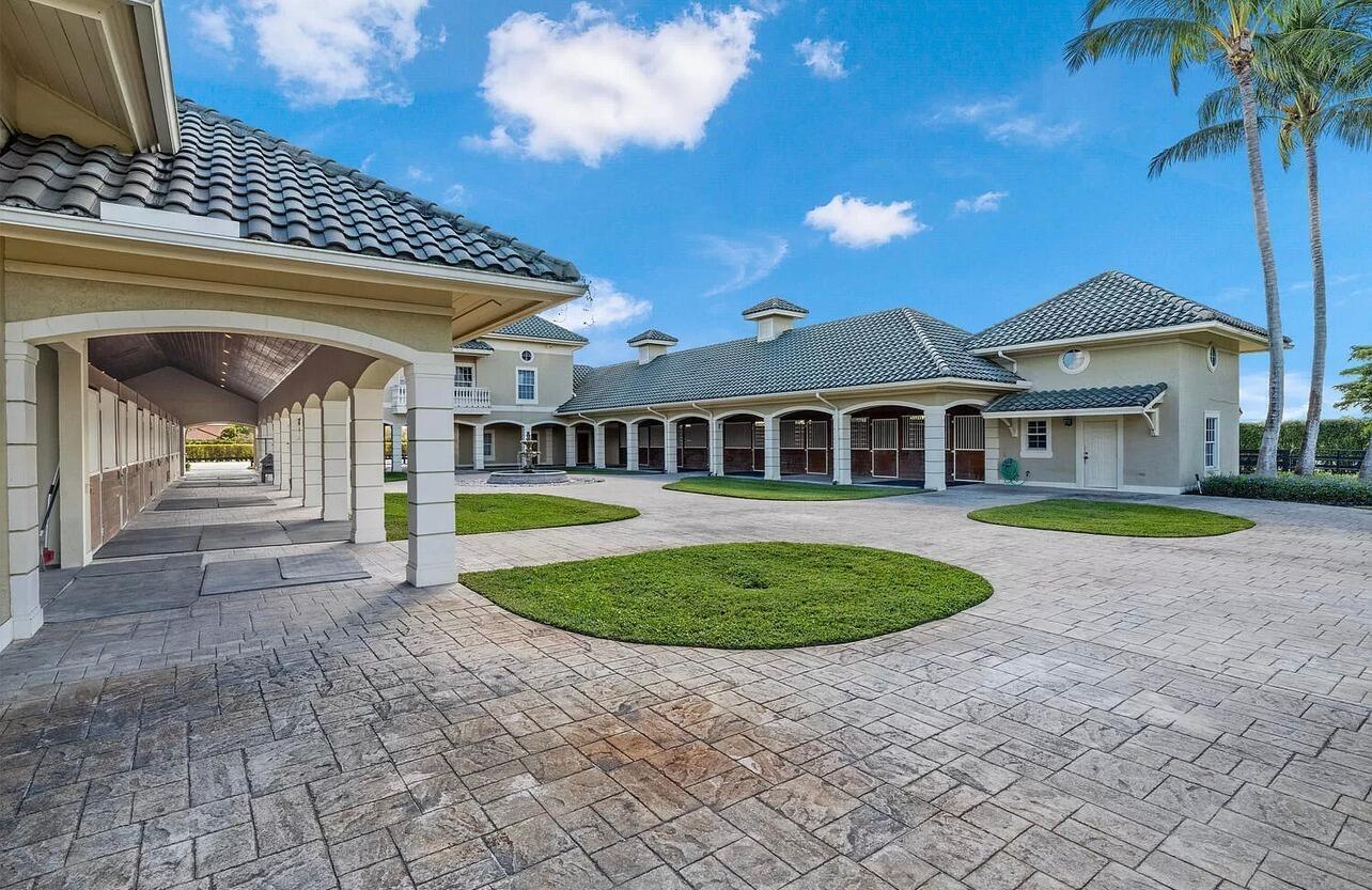4591 S Road Wellington, FL 33414 - Photo 13 of 42 a view of outdoor space yard and swimming pool