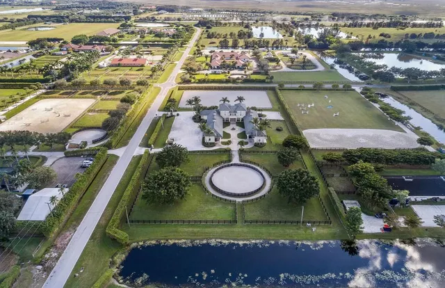 an aerial view of a residential houses with outdoor space