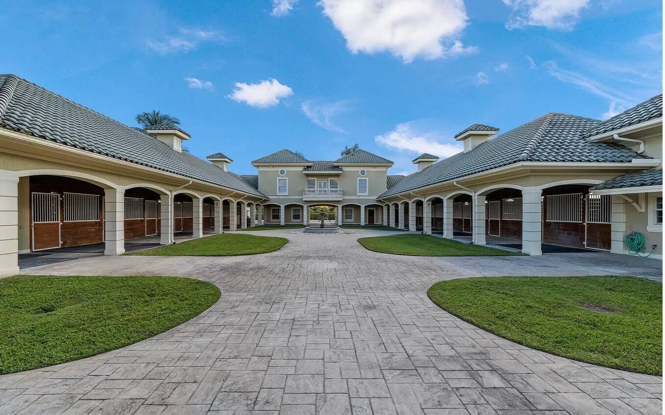 4591 S Road Wellington, FL 33414 - Photo 19 of 42 a view of house with a yard