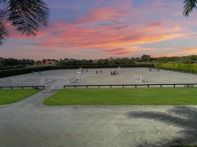 a view of a lake with houses in the back