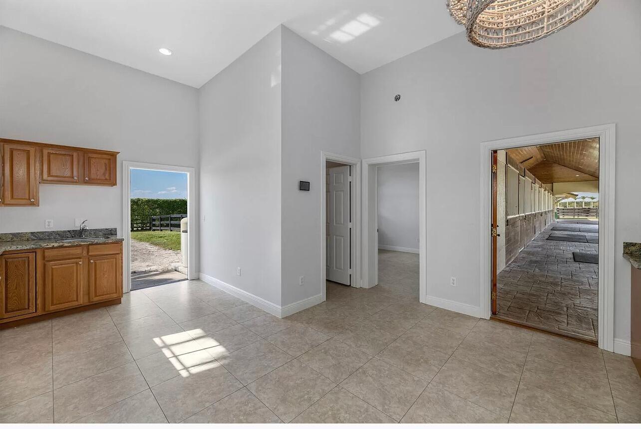 4591 S Road Wellington, FL 33414 - Photo 27 of 42 a view of kitchen with refrigerator and window