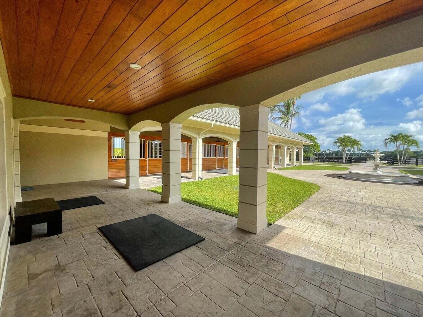 4591 S Road Wellington, FL 33414 - Photo 30 of 42 a view of swimming pool with an outdoor seating