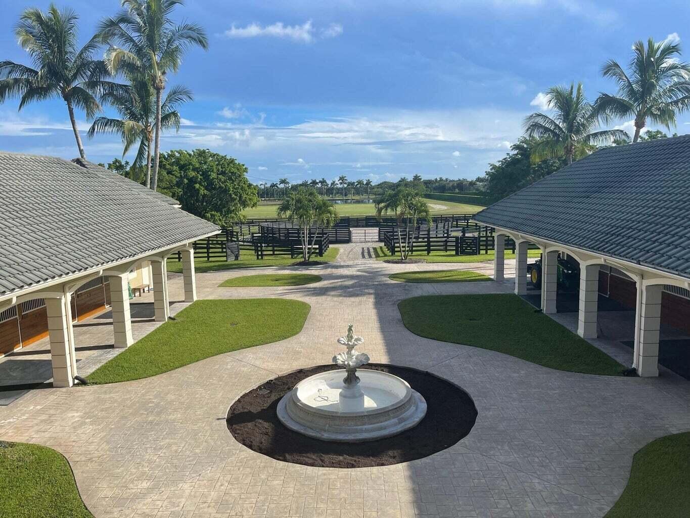 4591 S Road Wellington, FL 33414 - Photo 32 of 42 a view of a house with a yard