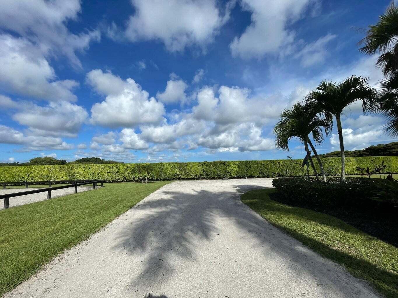 4591 S Road Wellington, FL 33414 - Photo 40 of 42 a view of a lake with a yard