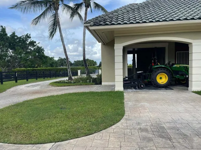 a view of a house with a backyard and porch