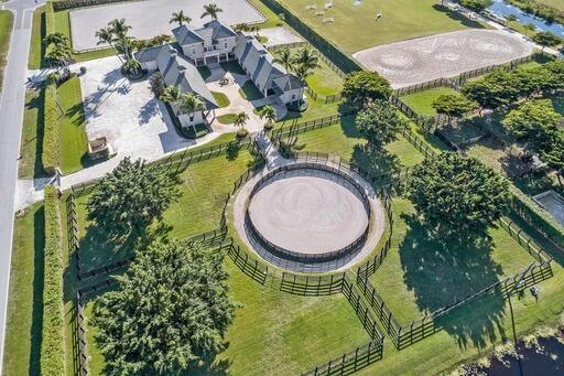 4591 S Road Wellington, FL 33414 - Photo 6 of 42 an aerial view of a house with swimming pool