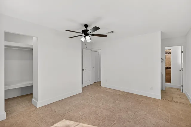 a view of an empty room with a bathroom