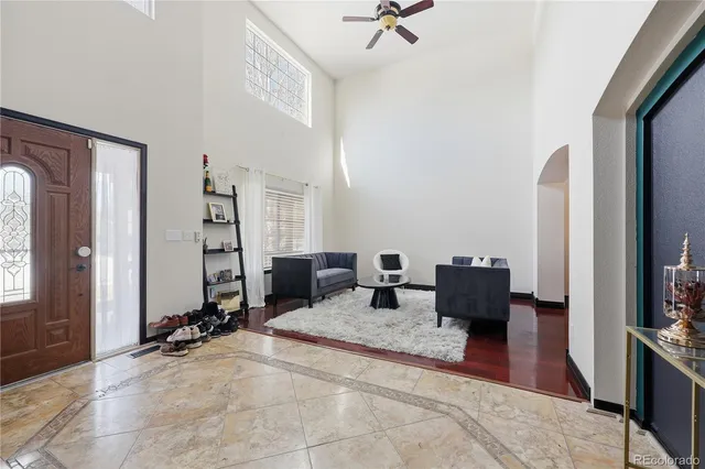 a living room with furniture windows and a flat screen tv