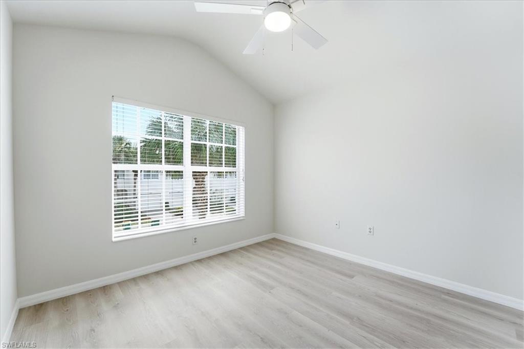1059 Albany Court, Unit 218 Naples, FL 34105 - Photo 25 of 29 an empty room with a window