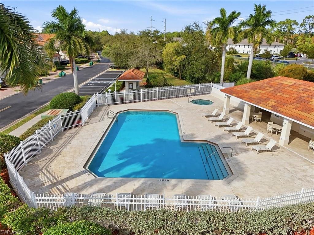 1059 Albany Court, Unit 218 Naples, FL 34105 - Photo 29 of 29 swimming pool view with a seating space