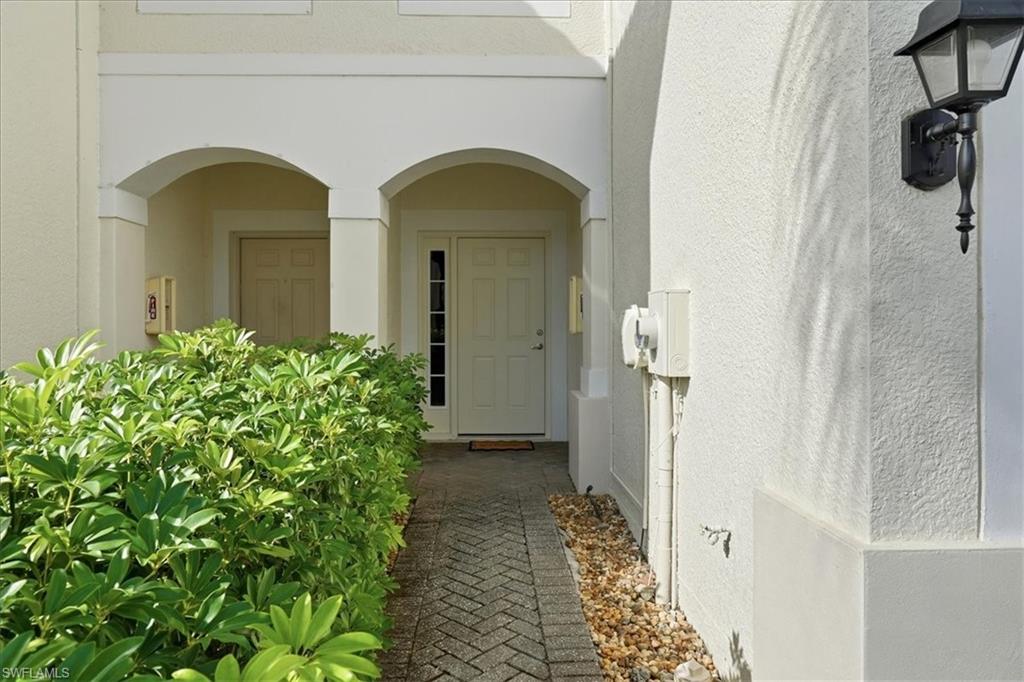 1059 Albany Court, Unit 218 Naples, FL 34105 - Photo 3 of 29 a view of a entryway door of the house