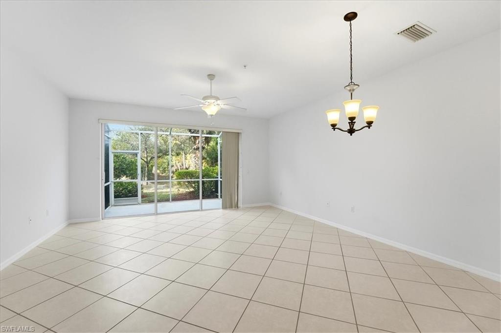 1059 Albany Court, Unit 218 Naples, FL 34105 - Photo 9 of 29 a view of an empty room with a window