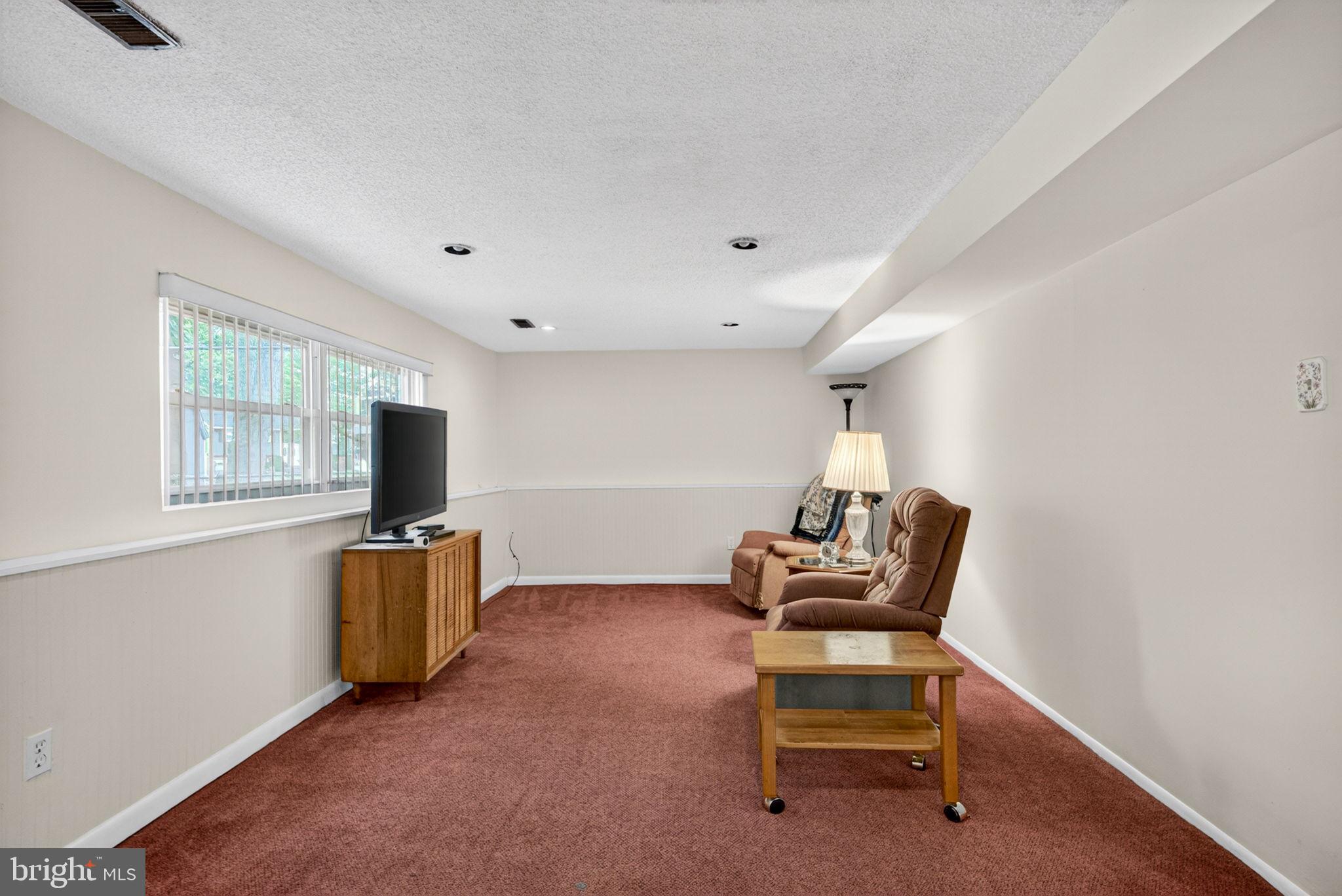 46 Trinity Avenue Marlton, NJ 08053 - Photo 21 of 37 a living room with furniture and a flat screen tv