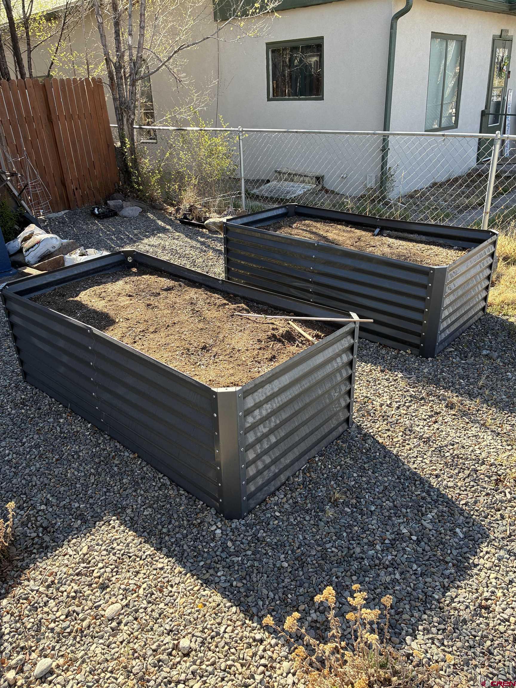 1002 State Avenue Alamosa, CO 81101 - Photo 3 of 19 a view of a backyard with sitting area