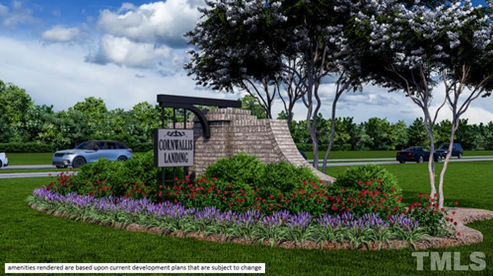 a view of a garden with flowers and trees