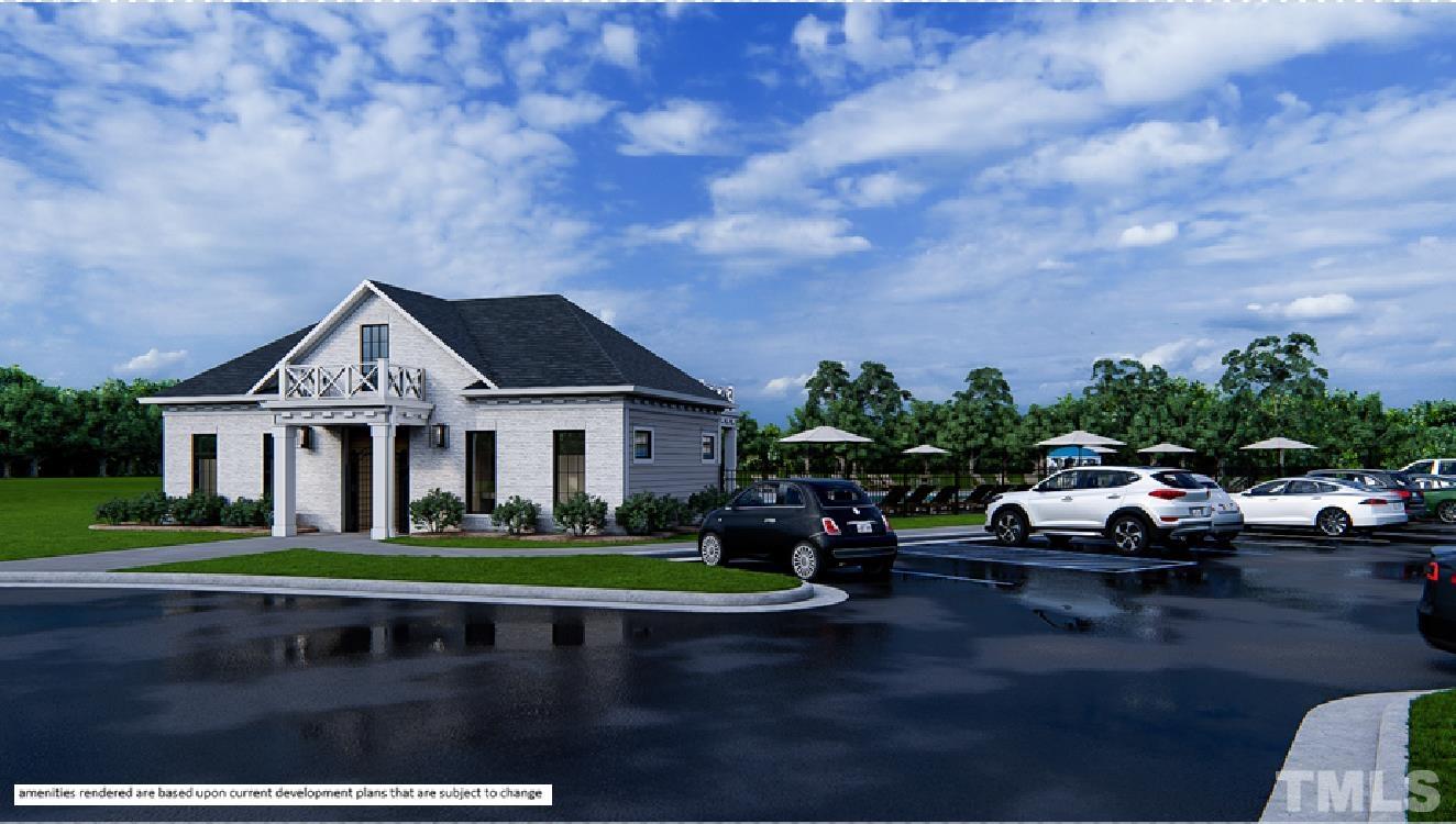246 Oak Branch Trail Garner, NC 27529 - Photo 27 of 28 a front view of a house with a garden