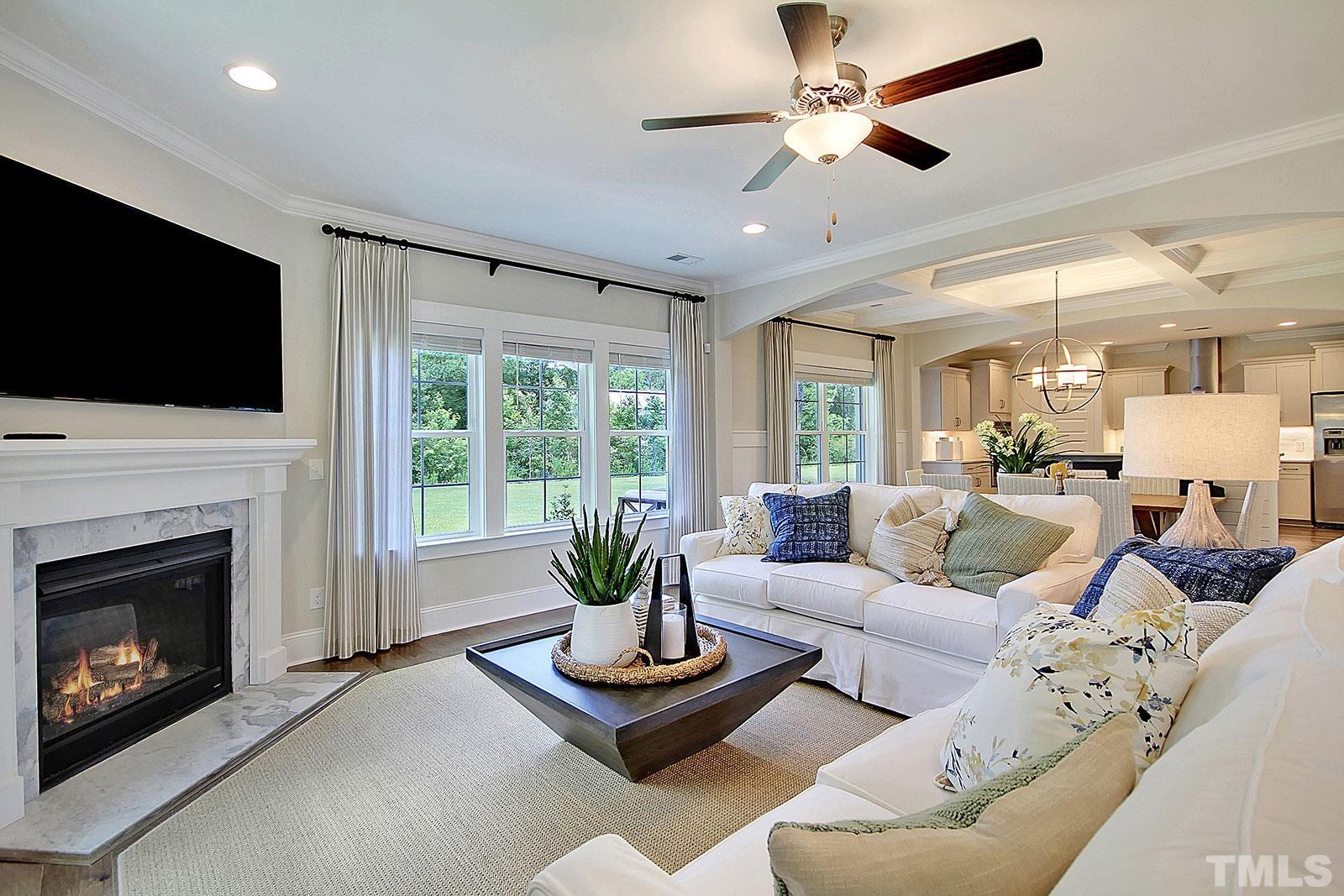 246 Oak Branch Trail Garner, NC 27529 - Photo 10 of 28 a living room with furniture fireplace and flat screen tv
