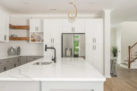 a bathroom with a sink a vanity and a mirror